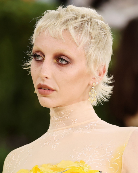 Closeup of Emma Chamberlain with livedin smoky eye makeup.